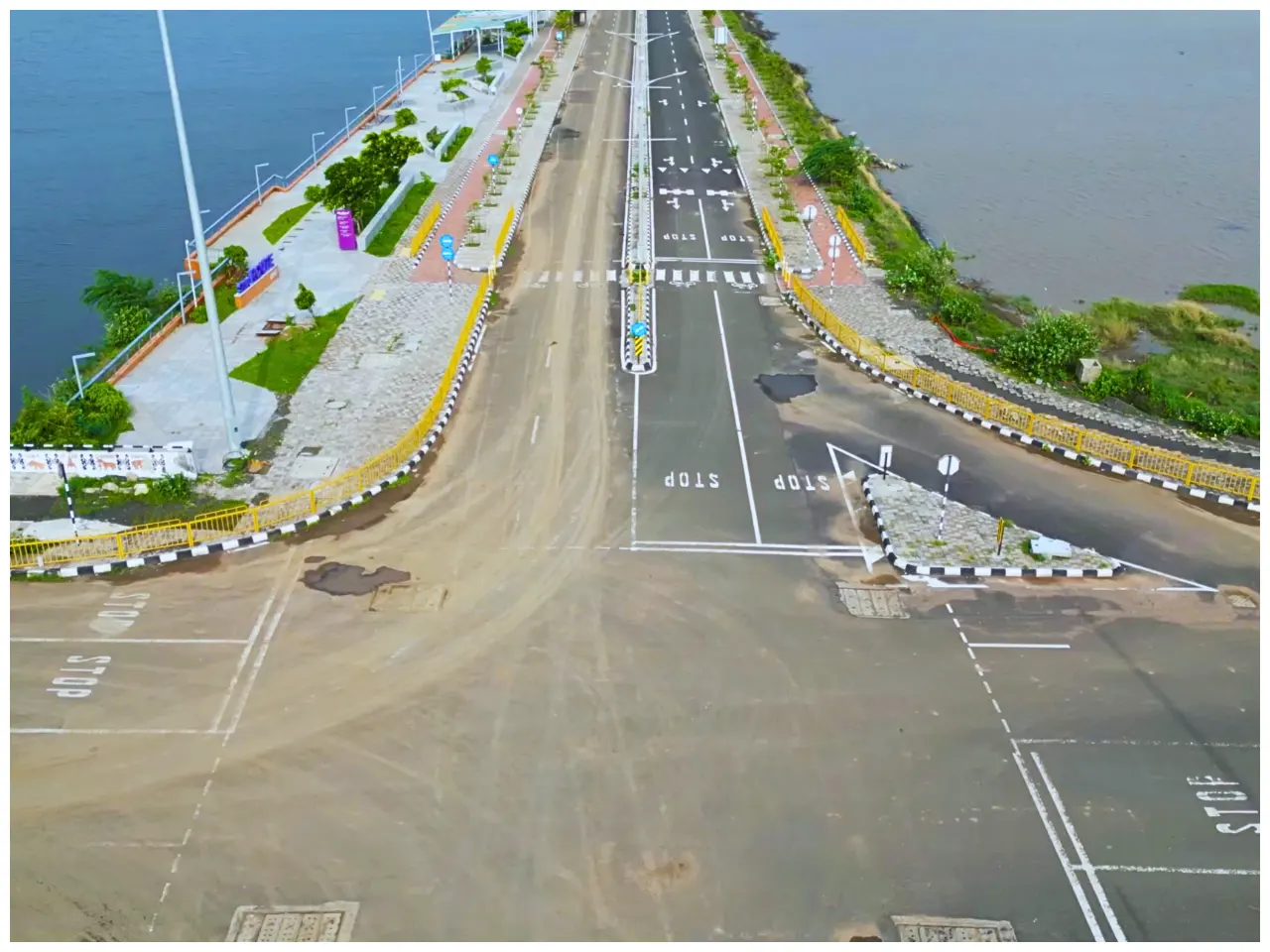 Aerial view of Dholera Smart City roads with canal side walkway